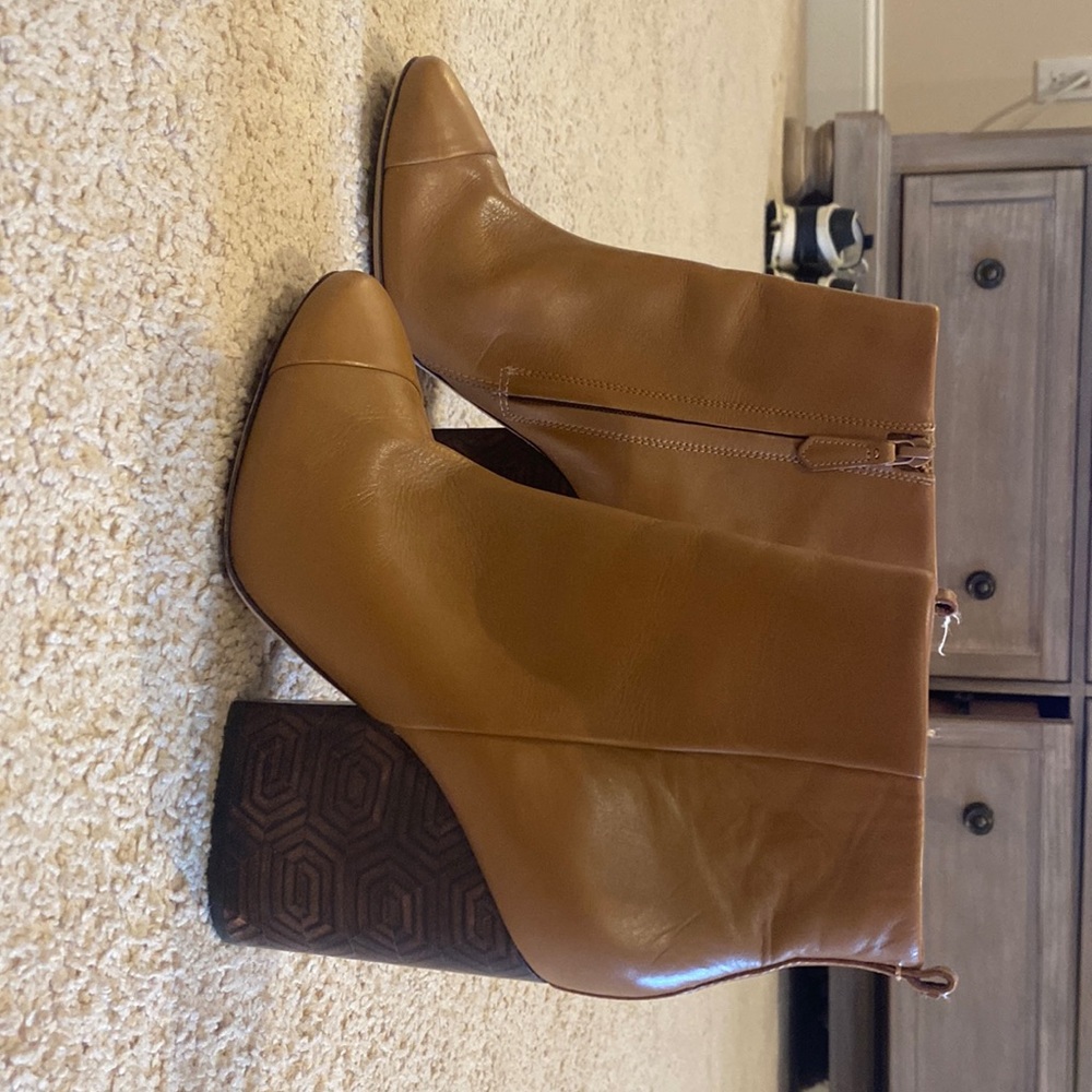 Tory Burch brown leather booties. Gently worn beautiful heel detail.